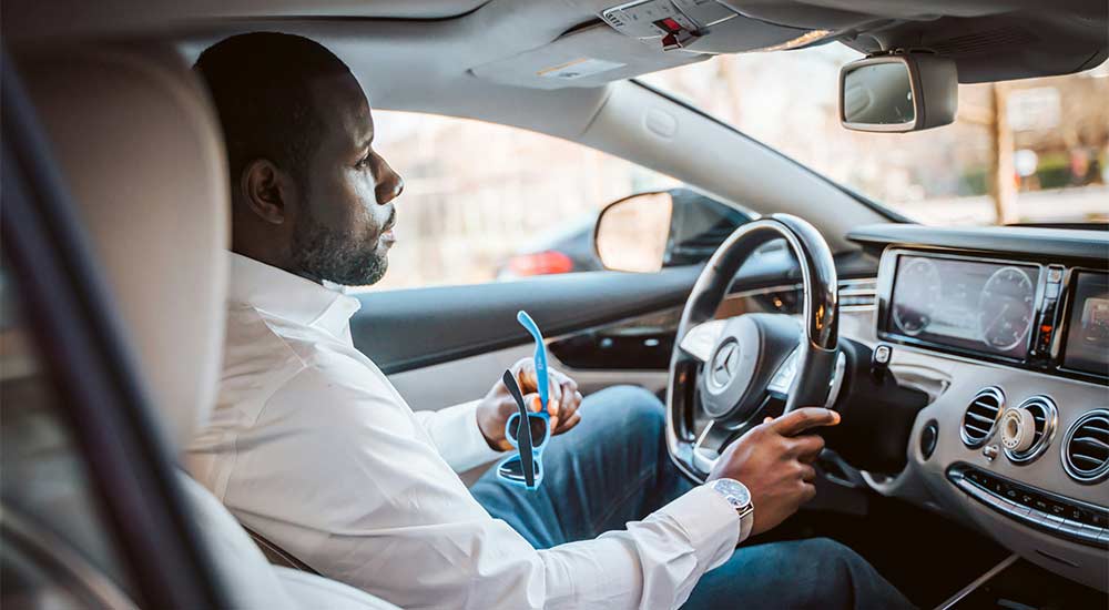 Man sitting in car